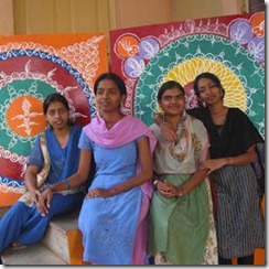 Young girls with their Rangoli inspired artwork.