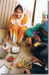 The first workshop, women painting square plates, 2002